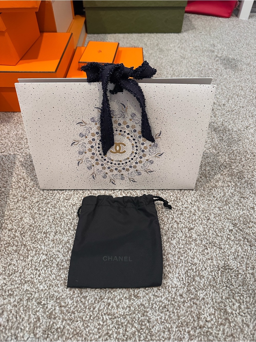 CHANEL White Decorative Shopping Bag with Gold Emblem and Navy Ribbon